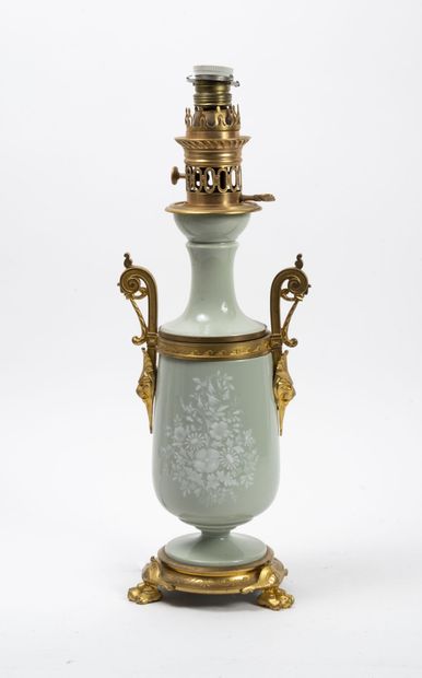 null Kerosene lamp base formed by a vase on pedestal in celadon enamelled ceramic,...