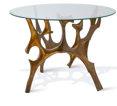 FRED BROUARD (1944-1999) Dining room table.
Legs in bronze.
Circular glass top.
73...