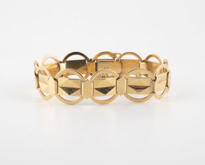 null Articulated bracelet in yellow gold (750) with a ring mesh crossed by a ribbon...