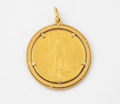 null Yellow gold pendant (750) holding in pinched setting a 20 dollars gold coin...