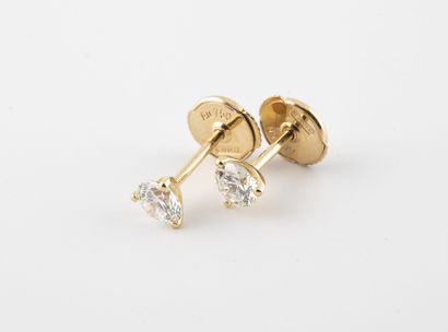 Pair of yellow gold (750) earrings set with...