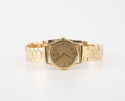 SEIKO Lady's wristwatch in yellow gold (750). 

Round case. 

Dial with golden background,...