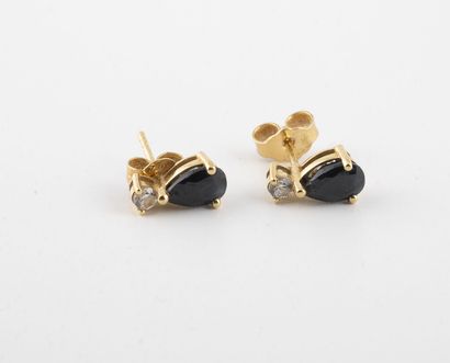 null Pair of yellow gold (750) earrings set with a faceted pear-shaped sapphire and...