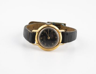 SILVANNA Small lady's wristwatch.

Yellow gold case (750)

Dial with black background,...