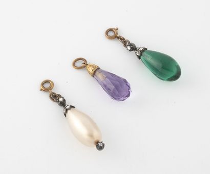 null Three small charms in green glass, purple or fancy pearl, in drop and yellow...