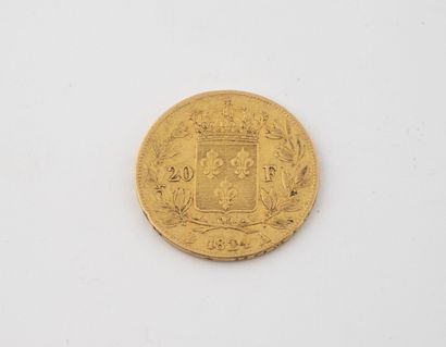 France Une pièce de 20 francs or, Louis XVIII, Paris, 1824.

Poids : 6.3 g. 

Rayures...