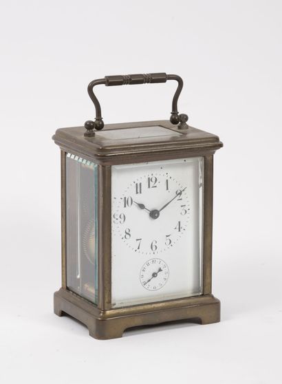 null Officer's clock with four brass mirrors.

White enamelled dial with painted...