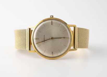 MARVIN Yellow gold (750) wristwatch for men.

Round case.

Dial with iridescent white...