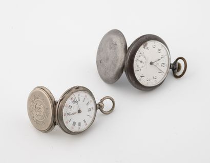 null Lot including:

- A silver collar watch (800). 

Back cover chased with a medallion...