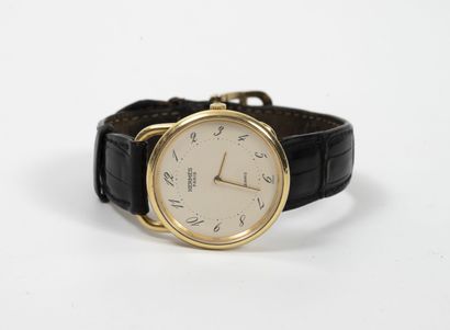 HERMES Paris, Arceau Men's wrist watch. 

Round case in yellow gold (750).

Dial...