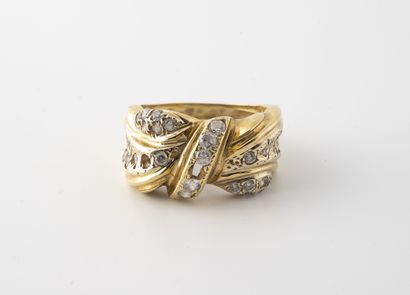 Yellow gold (750) ring with a knot of small...