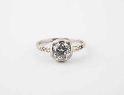Platinum (850) ring centered on a half-size...