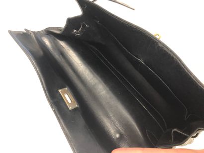 HERMES Paris Kelly bag 35 cm saddler version in black box calf.

Inside in black...