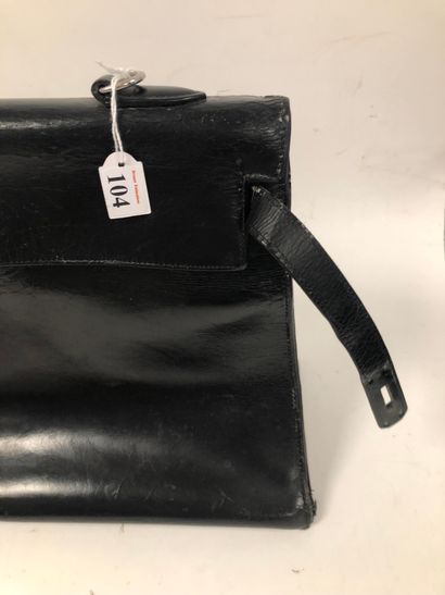 HERMES Paris Kelly bag 35 cm saddler version in black box calf.

Inside in black...