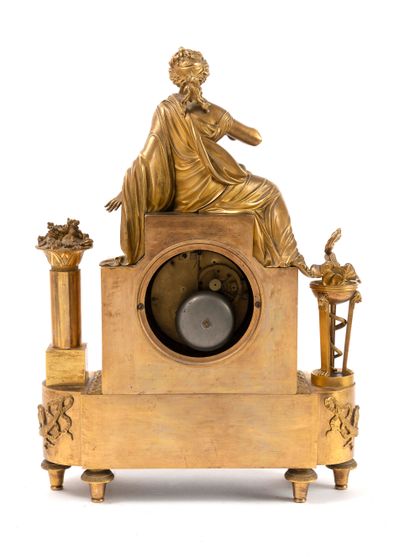  Bronze and brass terminal clock gilded with matte and bright, topped with the figure...