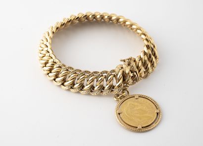 null Yellow gold (750) bracelet with stamped hollow American mesh holding a pendant...