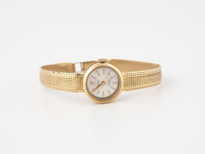 SUTIT Lady's wristwatch in yellow gold (750).

Circular case

Dial with silvered...