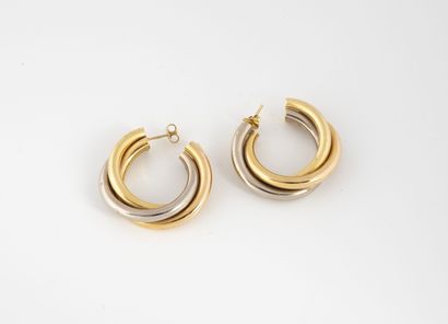 null Pair of creoles with three interlaced rings in gold (750) of three tones. 

System...