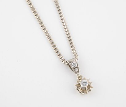 null Necklace in white gold (750) with filed gourmette link holding a star pendant...