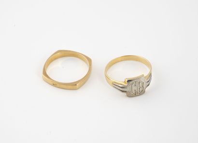 null Lot comprising a yellow gold (750) square wedding band with rounded edges and...