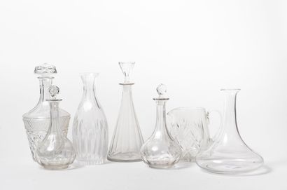 null Lot of six decanters or decanters and a pitcher in plain or cut glass or crystal.

Some...