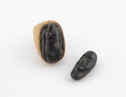 Wooden ring, decorated with a stone carved...