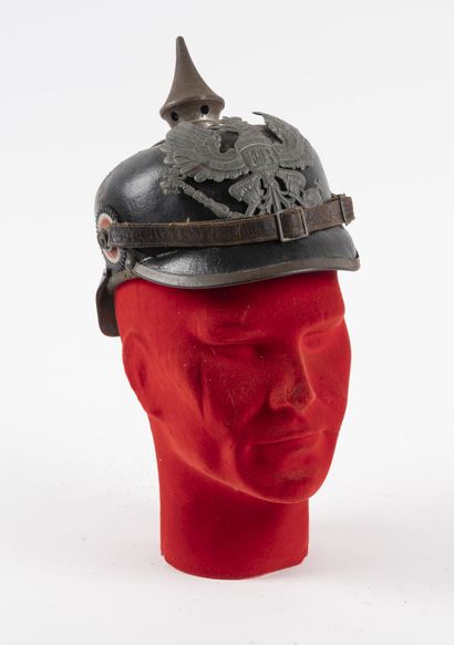 null Helmet with point model 1915 Prussian.

Shell pierced dated 1914, with cockades,...