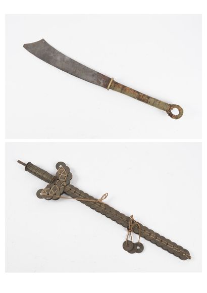 Lot :

- Asian saber with rope-covered handle.

-...