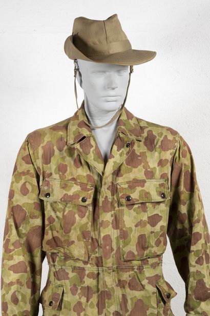 null Mannequin equipped with a USMC camouflaged HBT canvas suit with Conmar functional...