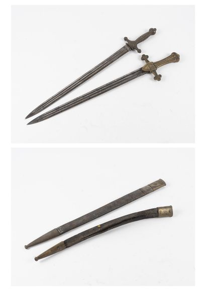 null Two swords with one-piece brass handles decorated with the Savoy Cross.

Steel...