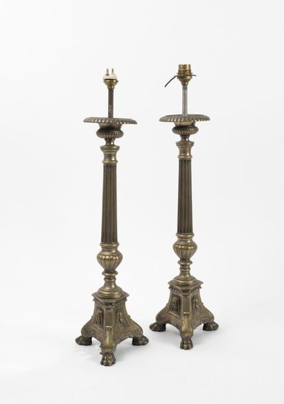 null Pair of brass pike poles, with fluted shaft and tripod base with clawed legs...