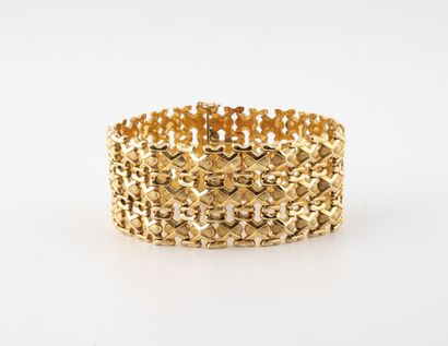 Large bracelet articulé en or jaune (750)...