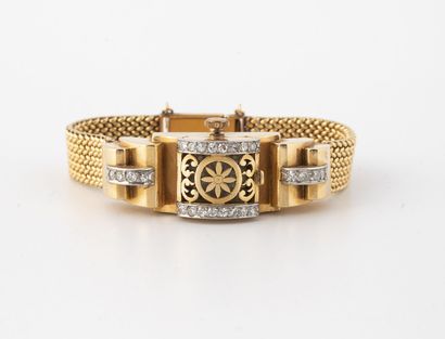 FLOR 
Montre bracelet de dame en or jaune (750) et platine (850).




Boîtier rectangulaire...
