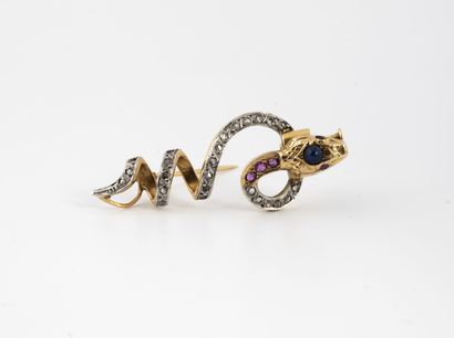 null Yellow gold (750) and platinum (850) coiled snake brooch, the body set with...