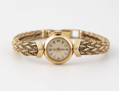 LIP Lady's wristwatch in yellow gold (750).

Round case. 

Dial with cream background,...
