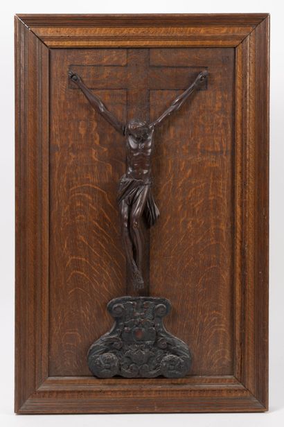 null Crucified Christ in carved wood presented on a molded oak panel with an engraved...