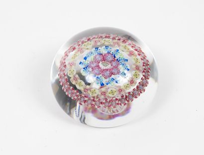 BACCARAT Paperweight ball in colorless crystal with inclusions of polychrome millefiori...