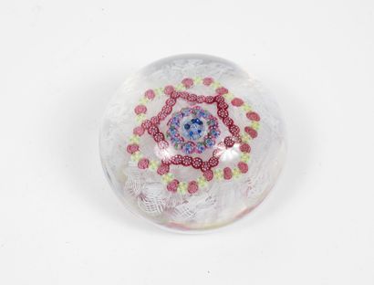 BACCARAT Paperweight ball in colorless crystal with inclusions of polychrome millefiori...