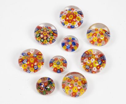 null Nine paperweights in colorless glass with inclusions of polychrome millefiori...