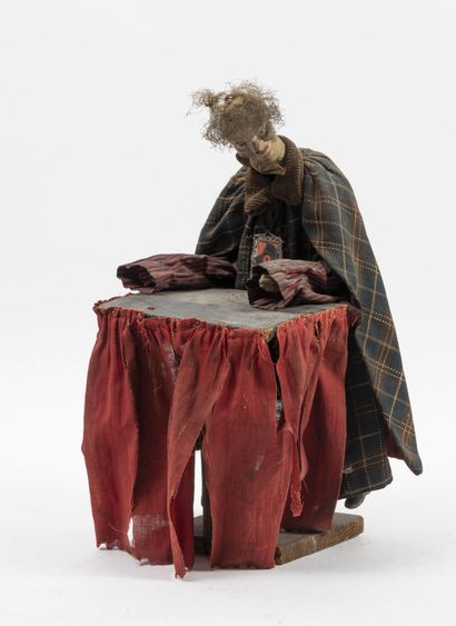 null Automaton in composition, fabric, wood and metal.

H. 35 cm.

Average condition,...