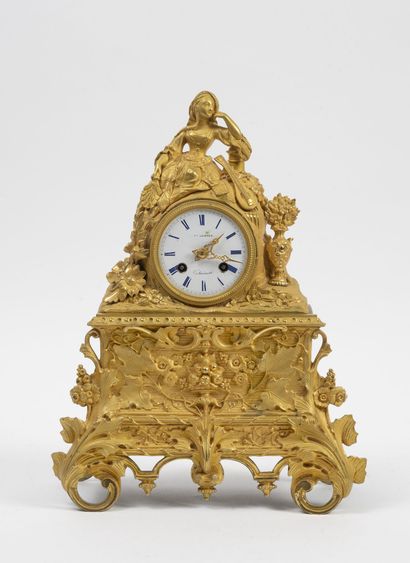 null Romantic clock in bronze and brass decorated with a young woman in the Italian...