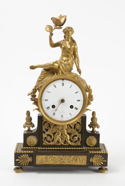 Chased and gilt bronze clock decorated with...