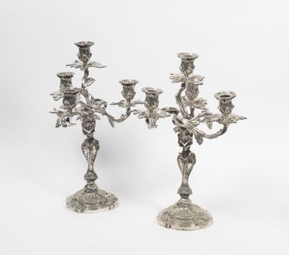 null Pair of rocaille style candelabras in silvered bronze with four lights decorated...