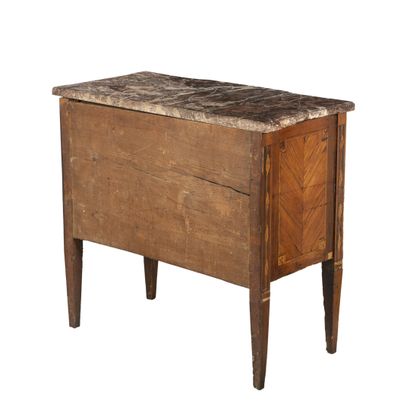 null Small chest of drawers with a central recess in exotic wood veneer and filleted...