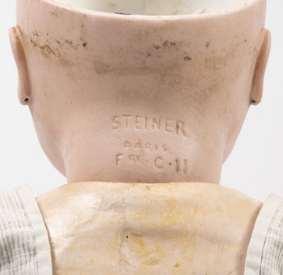 STEINER, Le Petit Parisien Porcelain doll head, closed mouth, blue eyes. 

Marked...