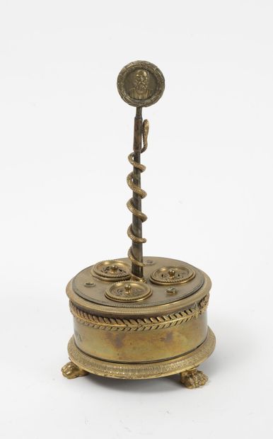 null Tripod inkwell in bronze of circular form with friezes of laurel leaves and...