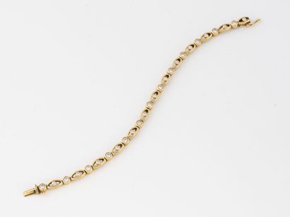 Bracelet ligne en or jaune (750) orné de...