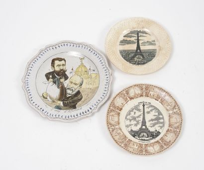 null Three earthenware plates, on the theme of the Eiffel Tower and various, with...