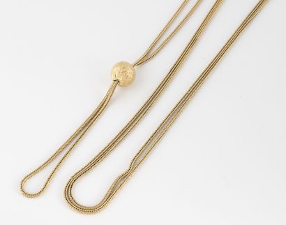 Long watch chain in yellow gold (750) holding...