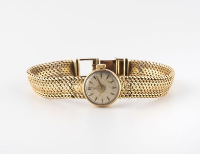 YEMA Ladies' wristwatch in yellow gold (750).
Round case. 
Dial with silvered background,...